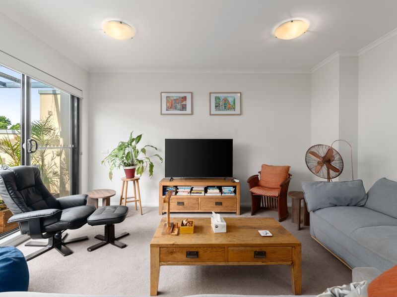 Unwind in the light-filled living area, designed for comfort after a day of exploring.