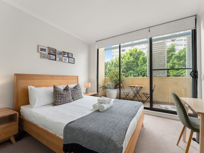 Enjoy another spacious bedroom with balcony access, perfect for relaxing after a busy day.