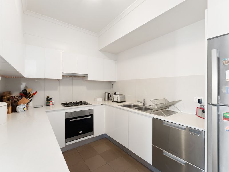 Everything you need for home cooking is at your fingertips in this bright, functional kitchen.
