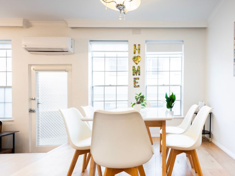 Natural light pours into the dining room, creating a warm and welcoming atmosphere.