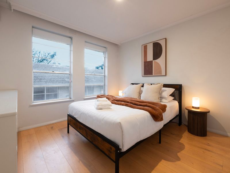 Drift off in the beautifully styled master bedroom with soft ambient lighting.