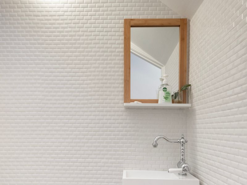 Contemporary finishes create a fresh and polished bathroom space.