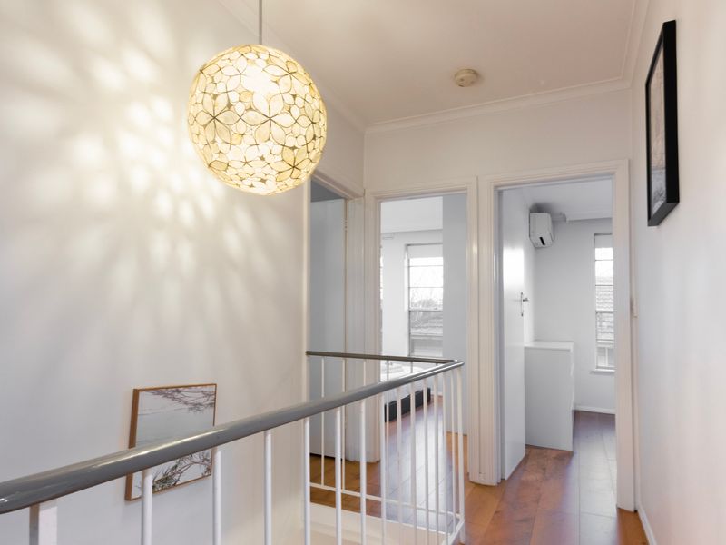 An airy landing enhances the home's spacious and open design.