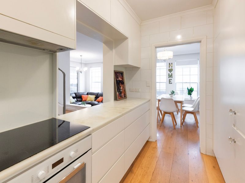 Clean lines and clever storage make the kitchen both practical and stylish.