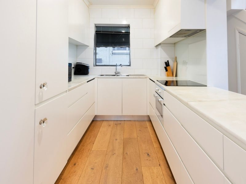 The streamlined kitchen offers plenty of bench space for effortless meal preparation.