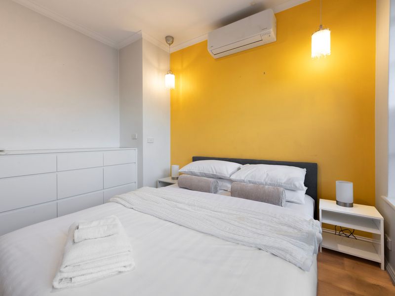 Bright interiors and contemporary furnishings make this bedroom feel instantly inviting.