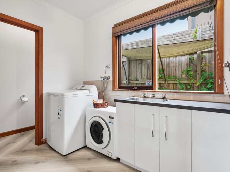 A dedicated laundry area with a washer adds extra convenience for longer stays.