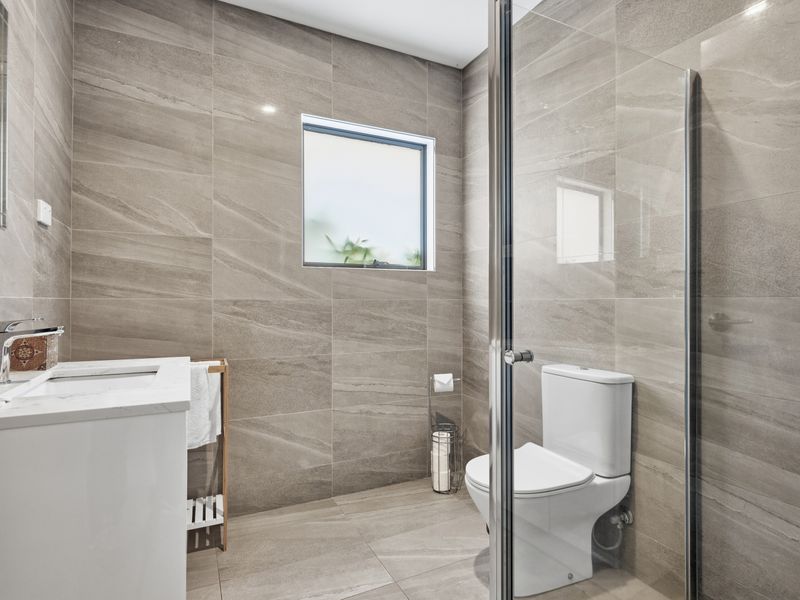 Downstairs bathroom 2 - Freshen up in the contemporary bathroom featuring a walk-in shower and modern finishes.