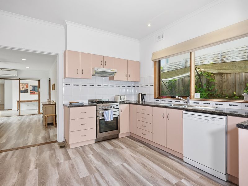 Prepare delicious meals in the spacious kitchen with generous bench space and garden views.