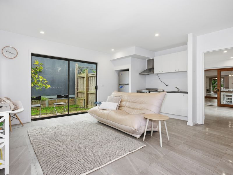 The open-plan family room offers the perfect place to relax with seamless indoor-outdoor living.