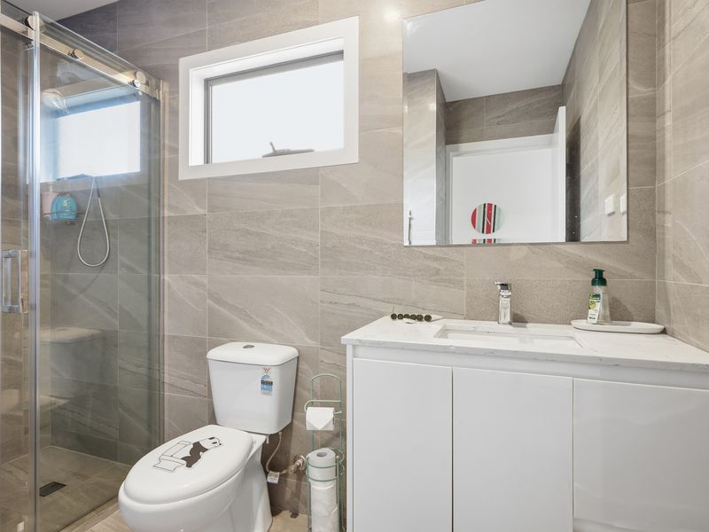 Bedroom 5 ensuite features contemporary finishes and everything you need for a comfortable stay.