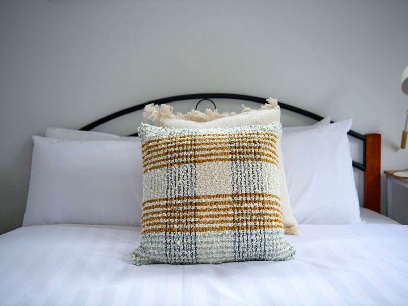 Soft linens and plush bedding ensure a comfortable and relaxing night's sleep.