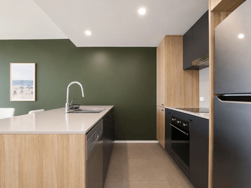 Bright open plan kitchen with breakfast bar