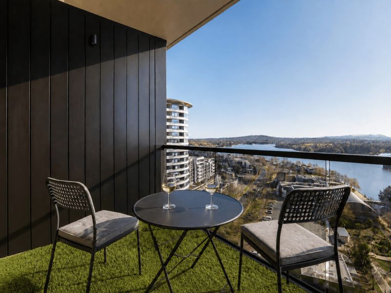Private balcony with seating and uninterrupted water views.