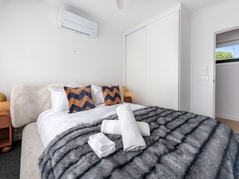 Large windows fill the room with sunshine, creating a warm and welcoming atmosphere.