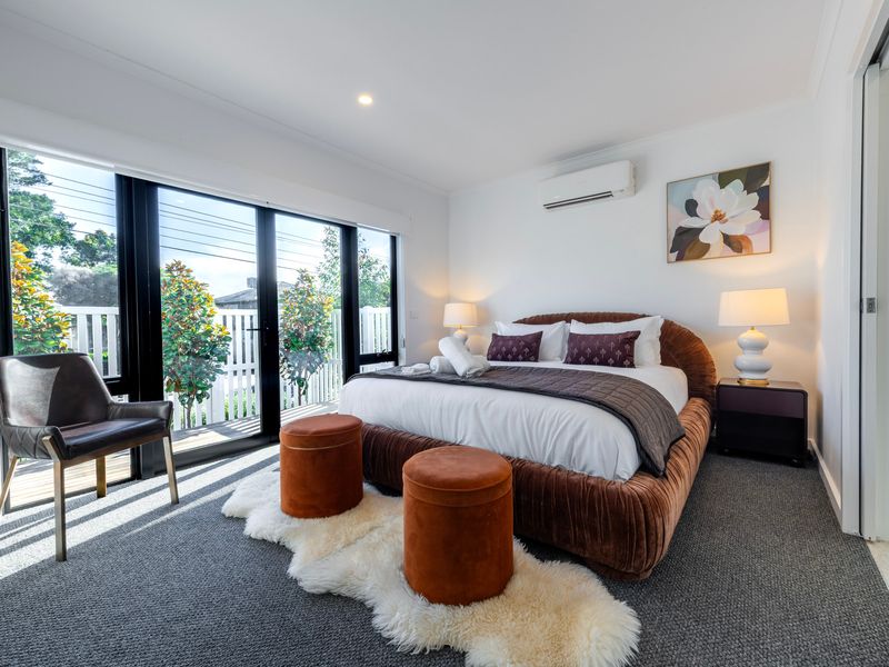 Enjoy a restful night's sleep in the comfortable master suite with modern furnishings.