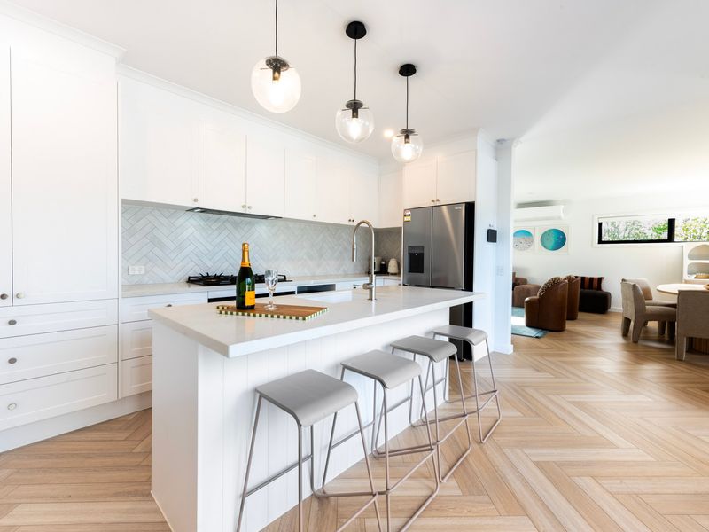 Prepare meals with ease in the fully equipped kitchen designed for convenience and functionality.