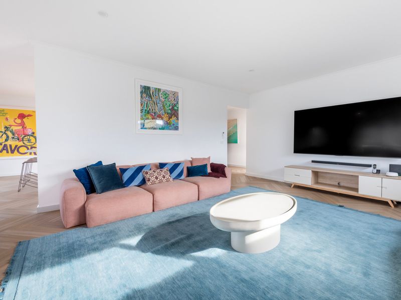 The bright and airy living room offers the perfect place to relax and reconnect.