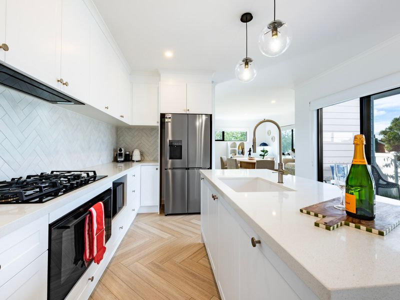 Wake up to beautiful natural light in the spacious master bedroom with balcony access.