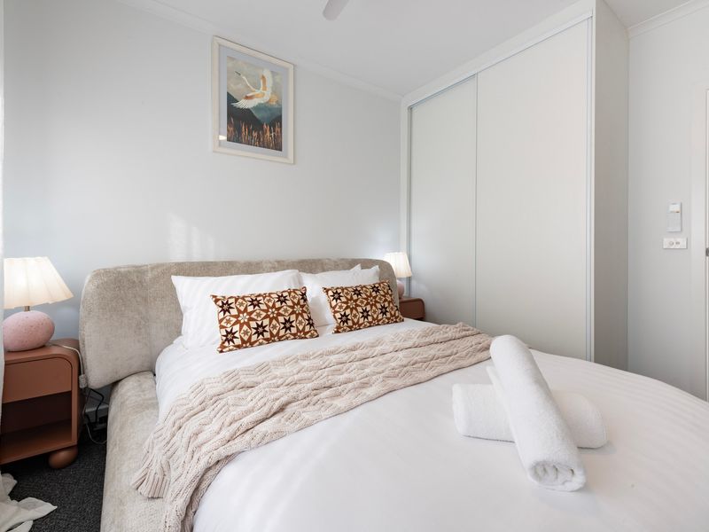 Comfortable bedding and calming décor make this bedroom the perfect place to recharge.
