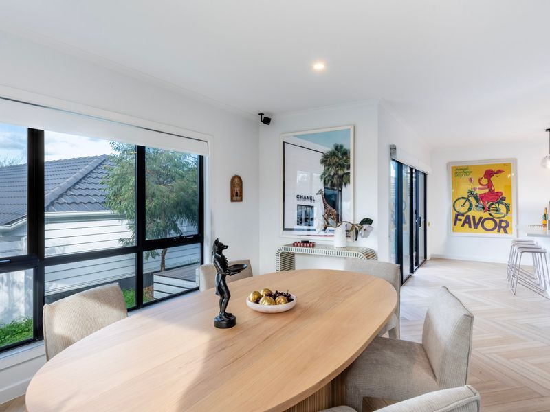 The light-filled dining space creates a welcoming setting for meals and conversation.