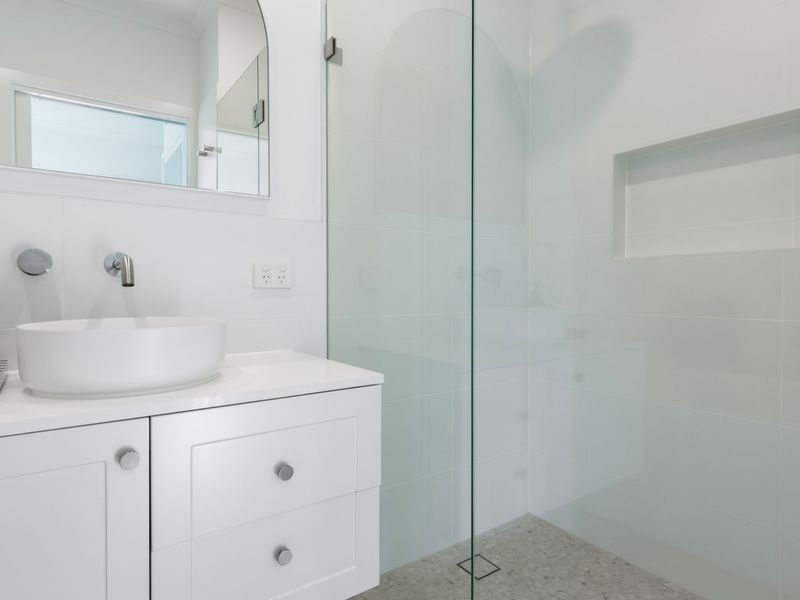 Freshen up in the sleek, modern bathroom featuring quality finishes and a spacious shower.