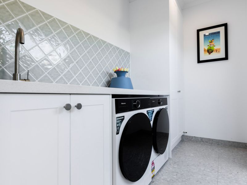 A dedicated laundry with washer and dryer provides all the comforts of home.