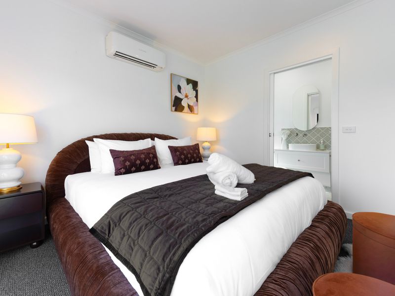 A bedroom easily accessible to bathroom.
