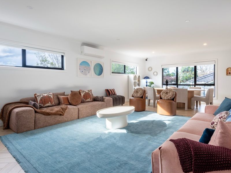 Relax in the spacious open-plan living area, filled with natural light and comfortable seating for the whole family.