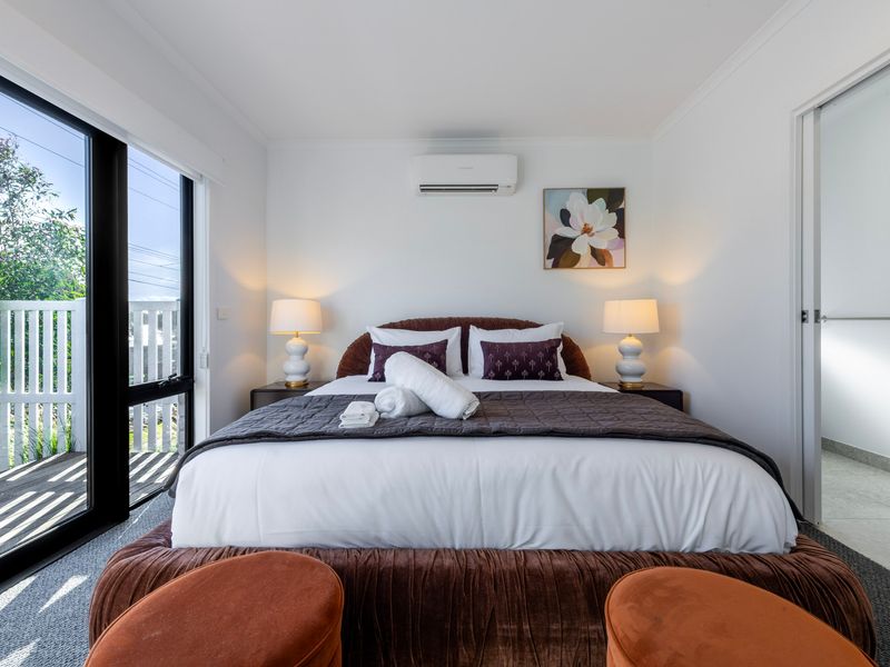 A cosy guest bedroom provides everything needed for a relaxing stay.