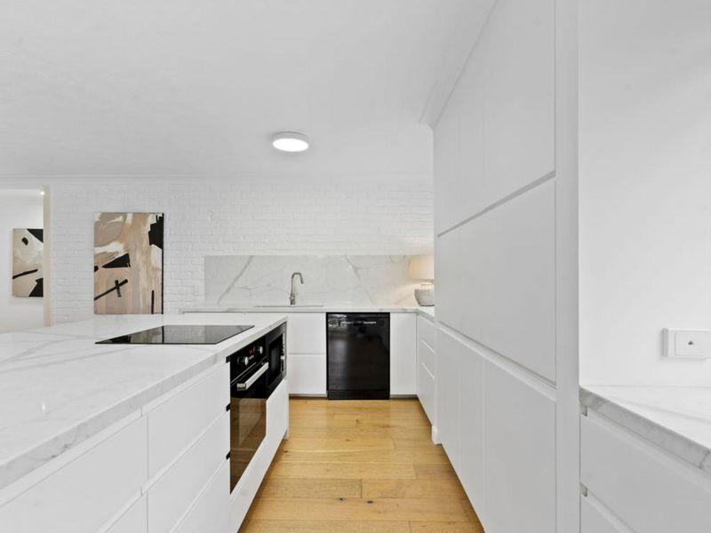 Cook with ease in the sleek contemporary kitchen, designed for both convenience and comfort.