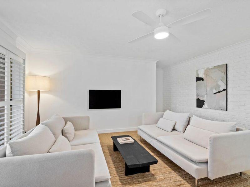 Relax in the bright and inviting living room, complete with comfortable seating and a Smart TV for cosy nights in