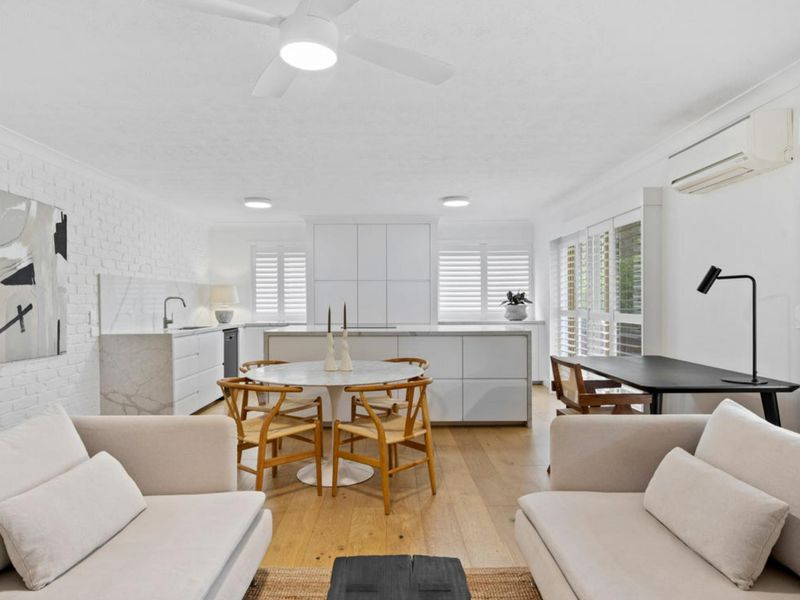 Prepare delicious meals in the modern kitchen while staying connected with family and friends in the open living area.