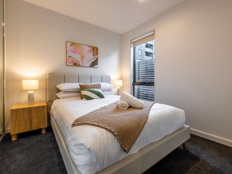 Another beautifully presented bedroom provides comfort and privacy.