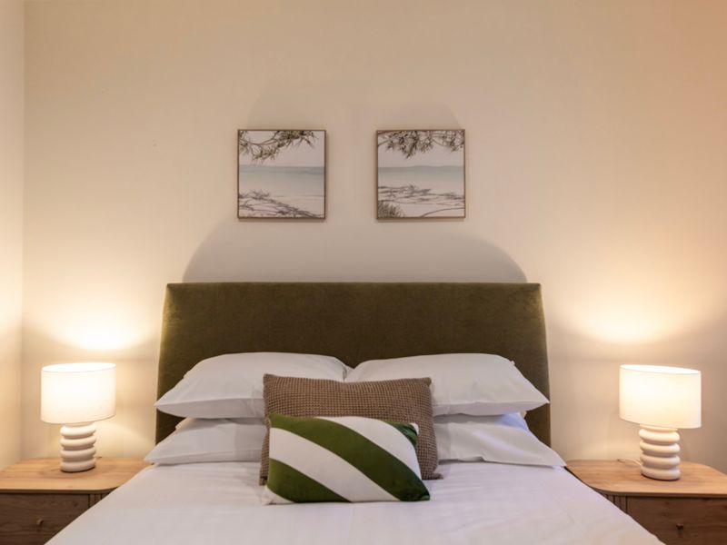 Soft bedside lighting creates a warm and relaxing atmosphere before bedtime.