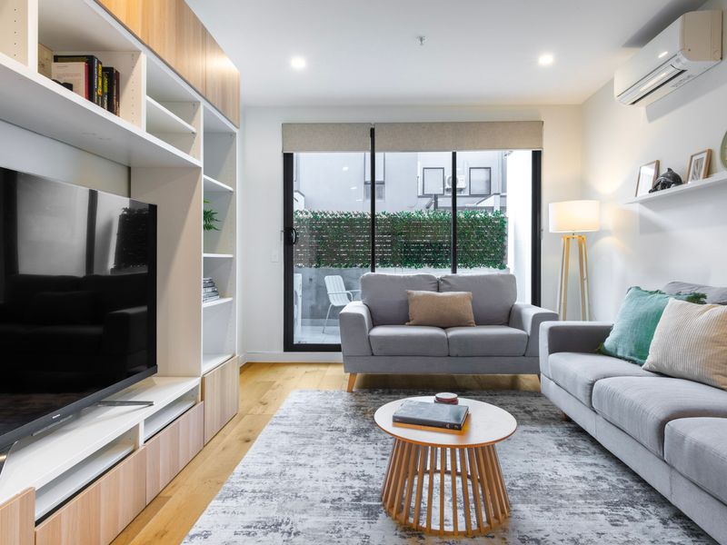 Relax in the inviting lounge with a Smart TV and direct balcony access.