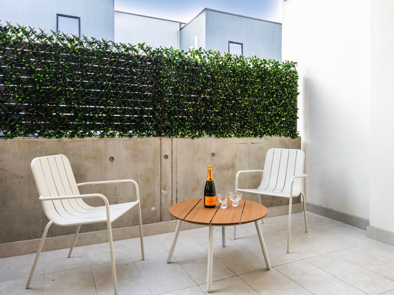 Enjoy a private outdoor patio, perfect for morning coffee or evening relaxation.