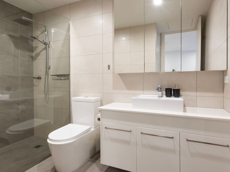 A contemporary bathroom combines practicality with stylish design.