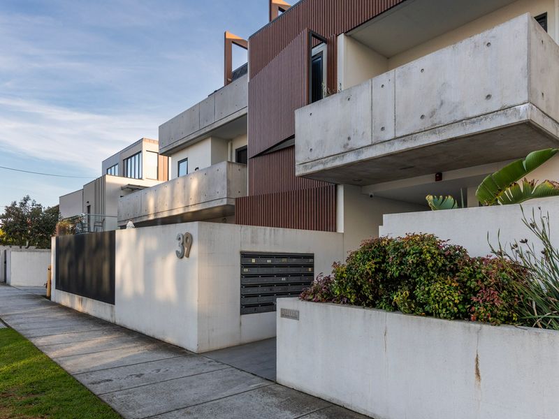 The modern apartment complex showcases contemporary architecture and well-kept surroundings.