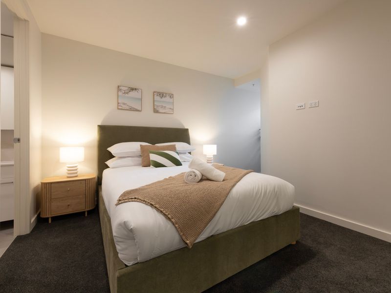 The spacious primary bedroom offers a peaceful retreat for restful nights.
