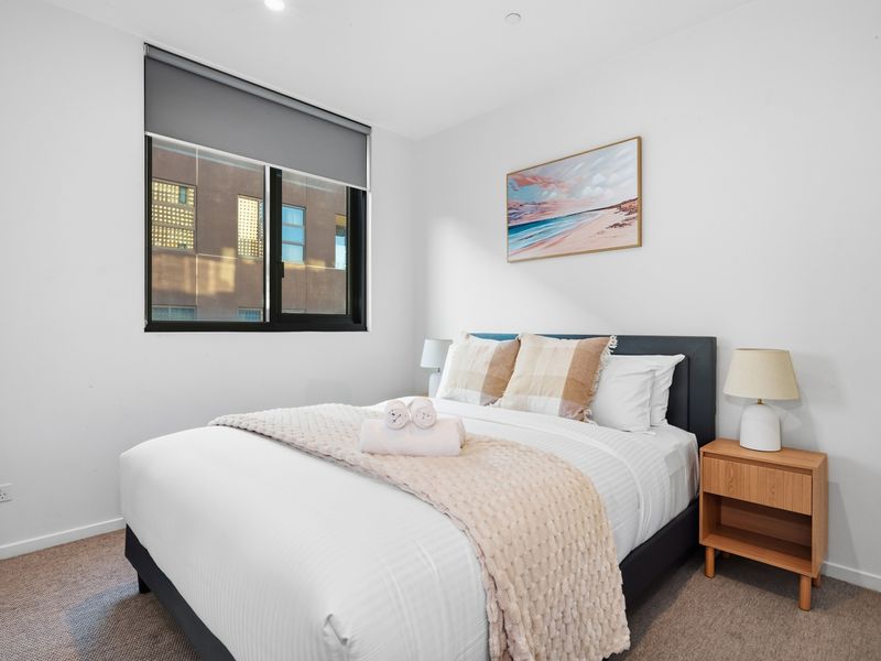 Retreat to a peaceful bedroom featuring crisp linens and a calming atmosphere.