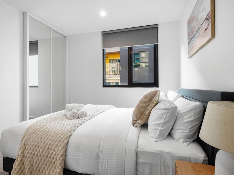Wake up refreshed in a bright bedroom designed for comfort and relaxation.