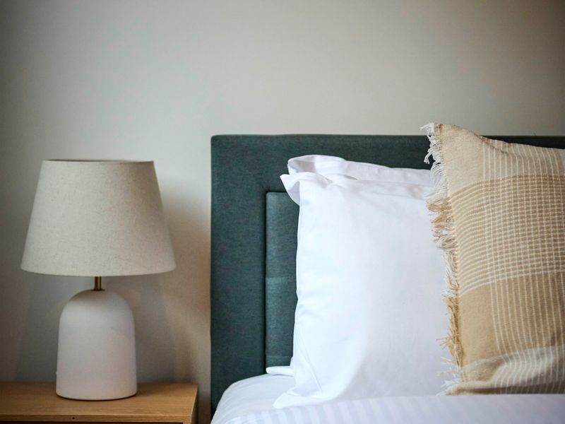 Soft textures and thoughtful styling bring warmth and comfort to the bedroom.