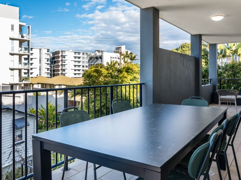 Enjoy alfresco dining and fresh coastal breezes on the balcony.