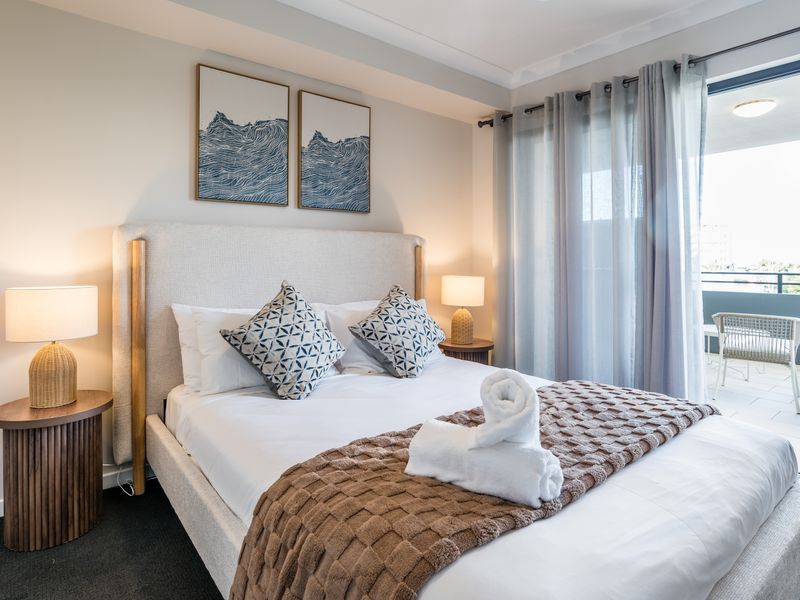 Wake up to natural light in this inviting queen bedroom.