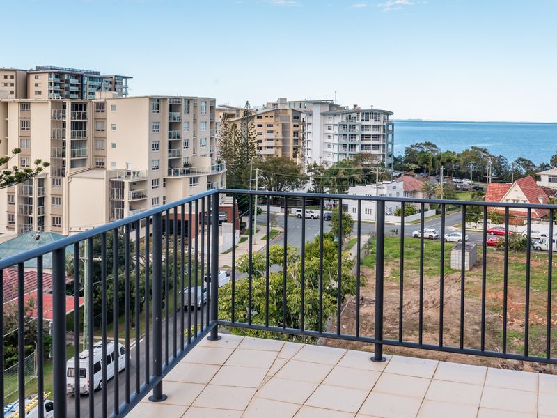 Elevated balcony offering leafy district views.