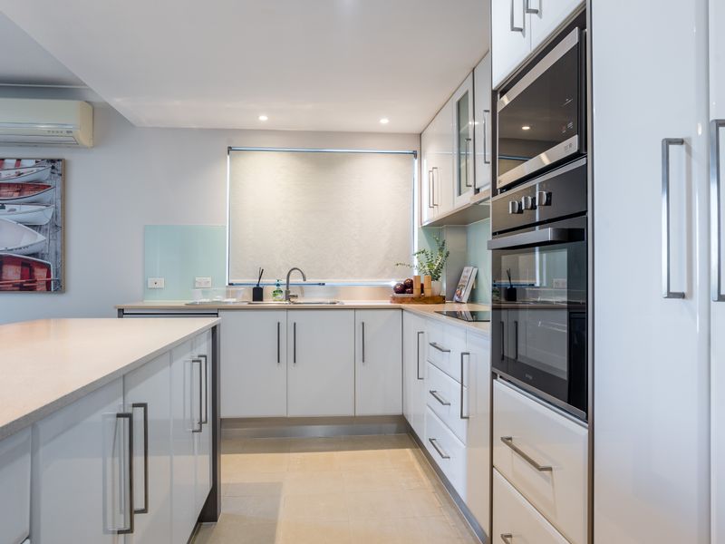 Functional galley kitchen designed for easy entertaining.