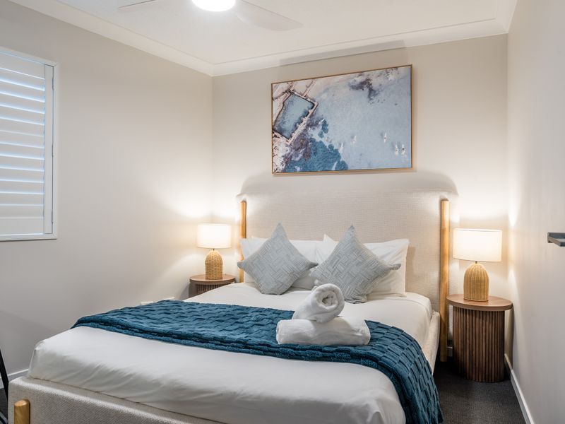 Second bedroom with a comfortable queen bed.