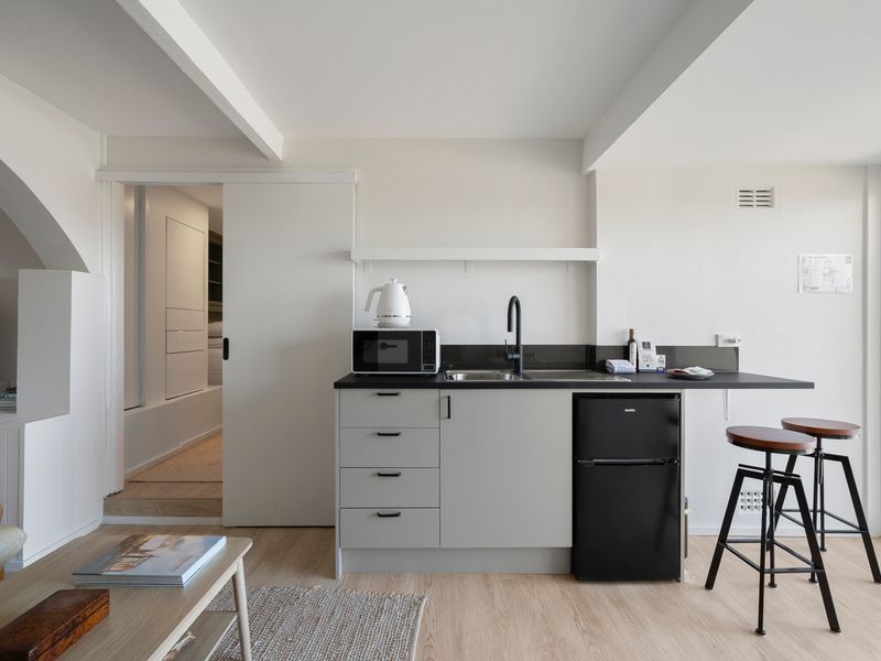 A thoughtfully designed kitchenette provides everything you need for effortless meals.