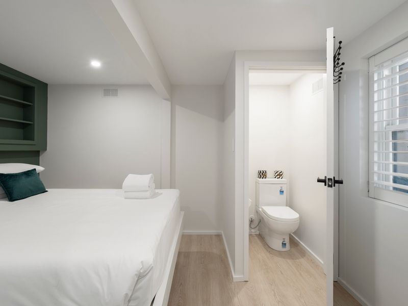 The cosy sleeping area includes a private ensuite for added comfort and convenience.